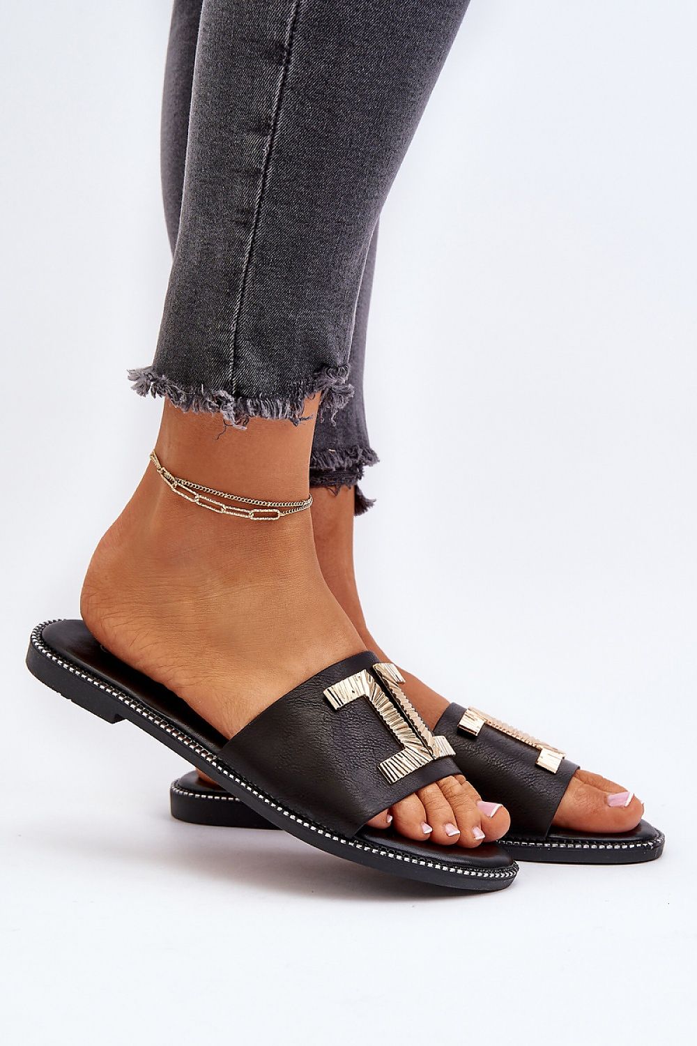 Black Flat Sandal for Woman with Chic Gold Decoration