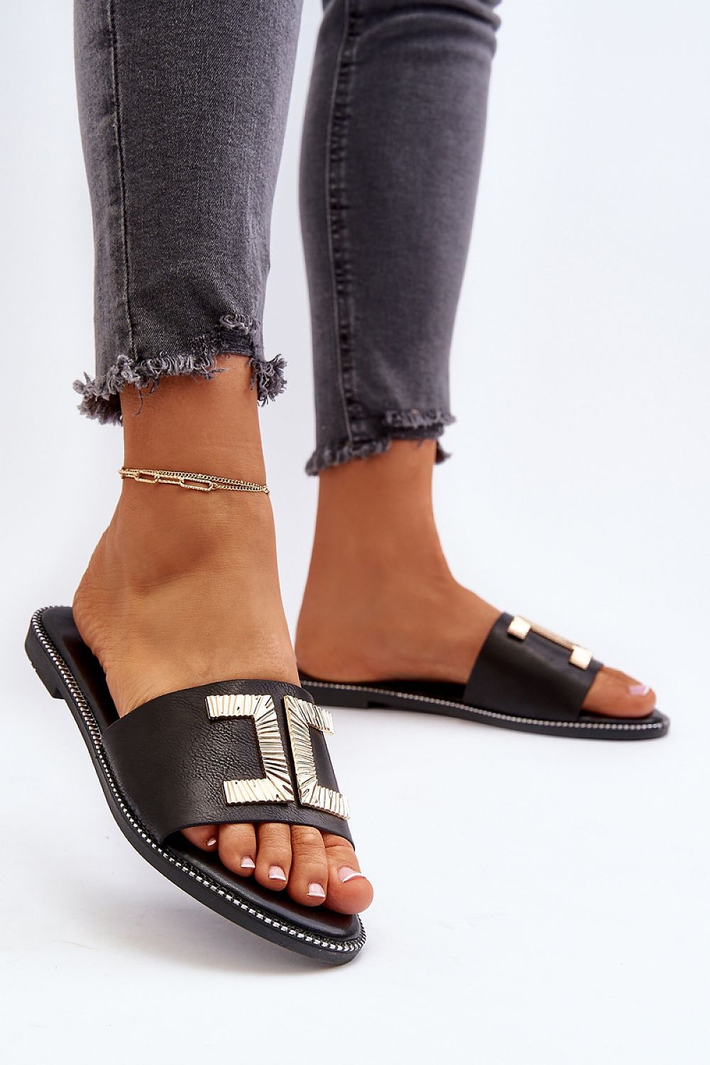 Black Flat Sandal for Woman with Chic Gold Decoration