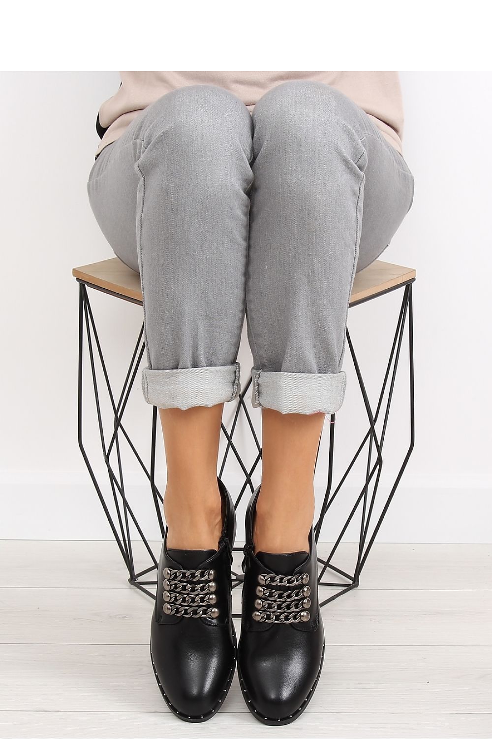 Woman's black lace up shoes with chain frontage